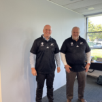 Rolf Leber and Matthias Altendorf receive personalised official All Blacks jerseys as a gift from EMC.